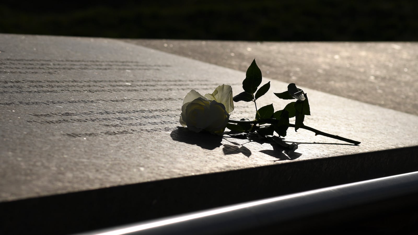LITTLETON CO - APRIL 17: A flower is left at the Columbine Memorial on April 17, 2019 in Littleton, Colorado. Districts across the Denver metro were then closed schools as the FBI and local police searched for 18-year-old Sol Pais, a woman from Florida suspected of making threats.