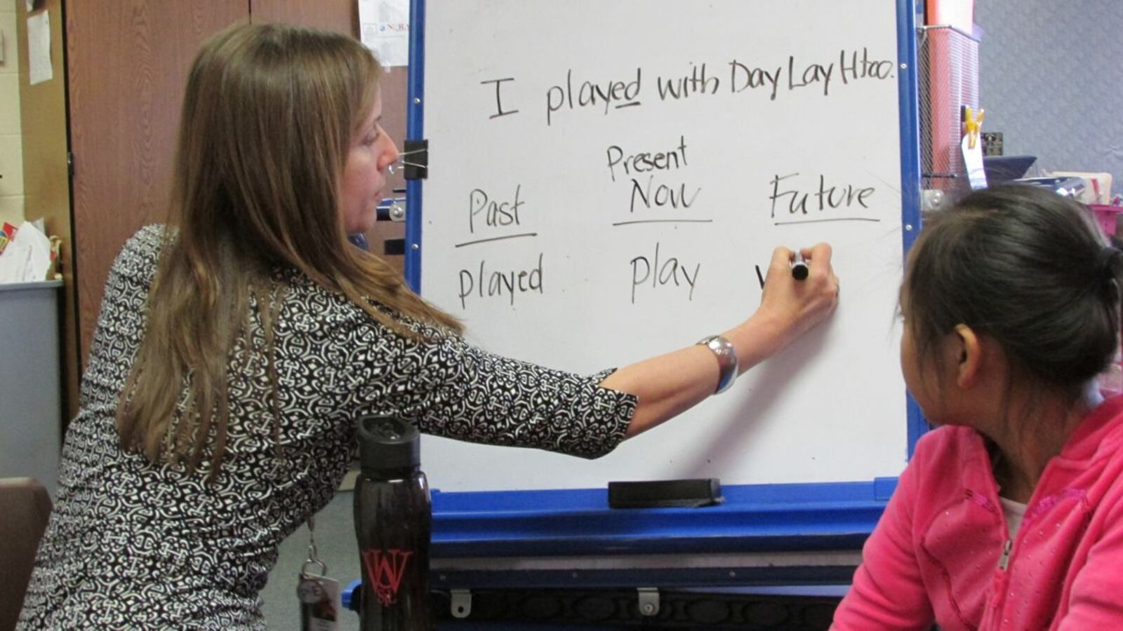 English language learning teacher Alison Fleischer works with refugee students in a small group at Nora Elementary School in Washington Township last year.