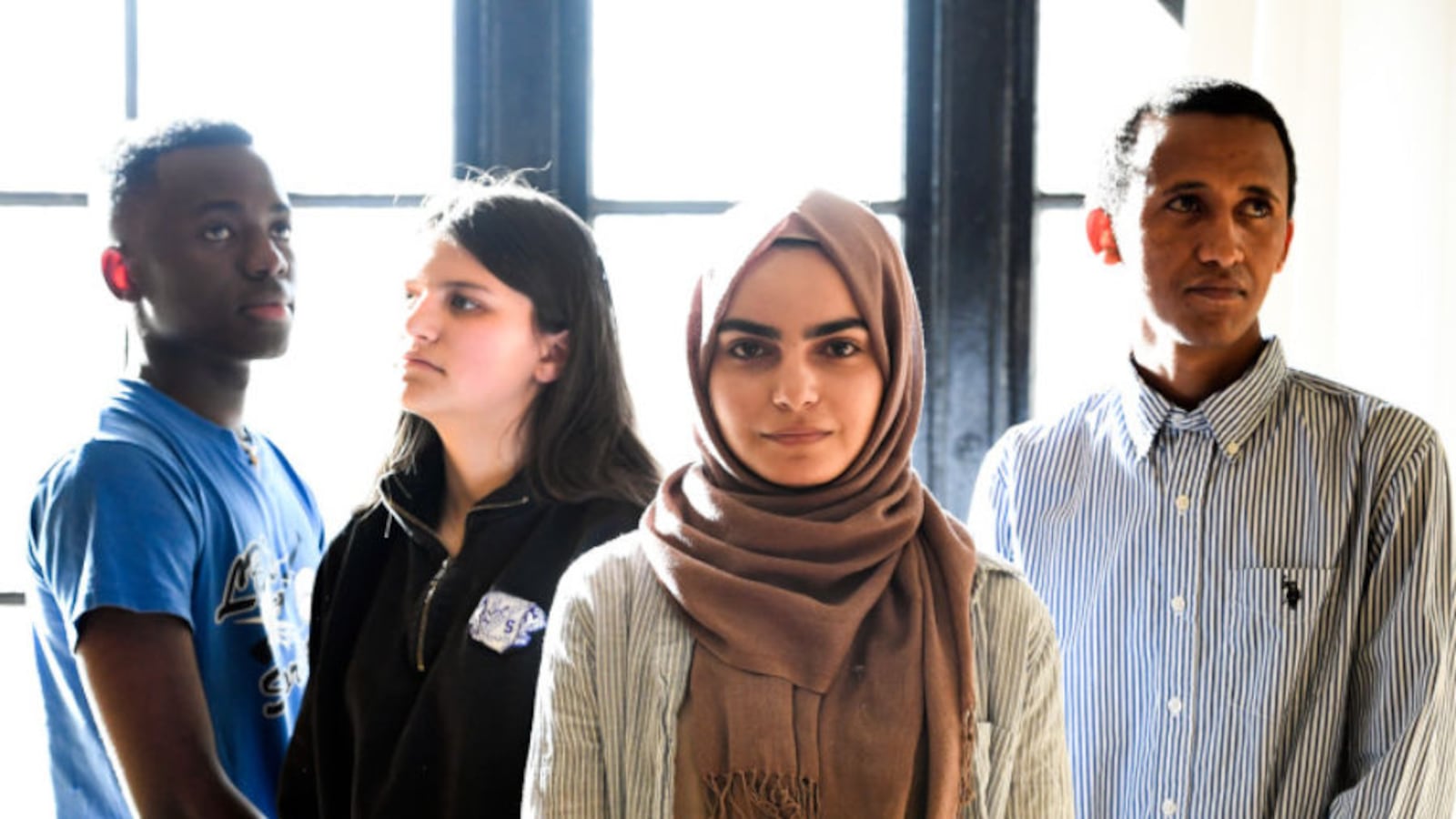 Refugee students pose for a portrait after an event at their school in Denver.