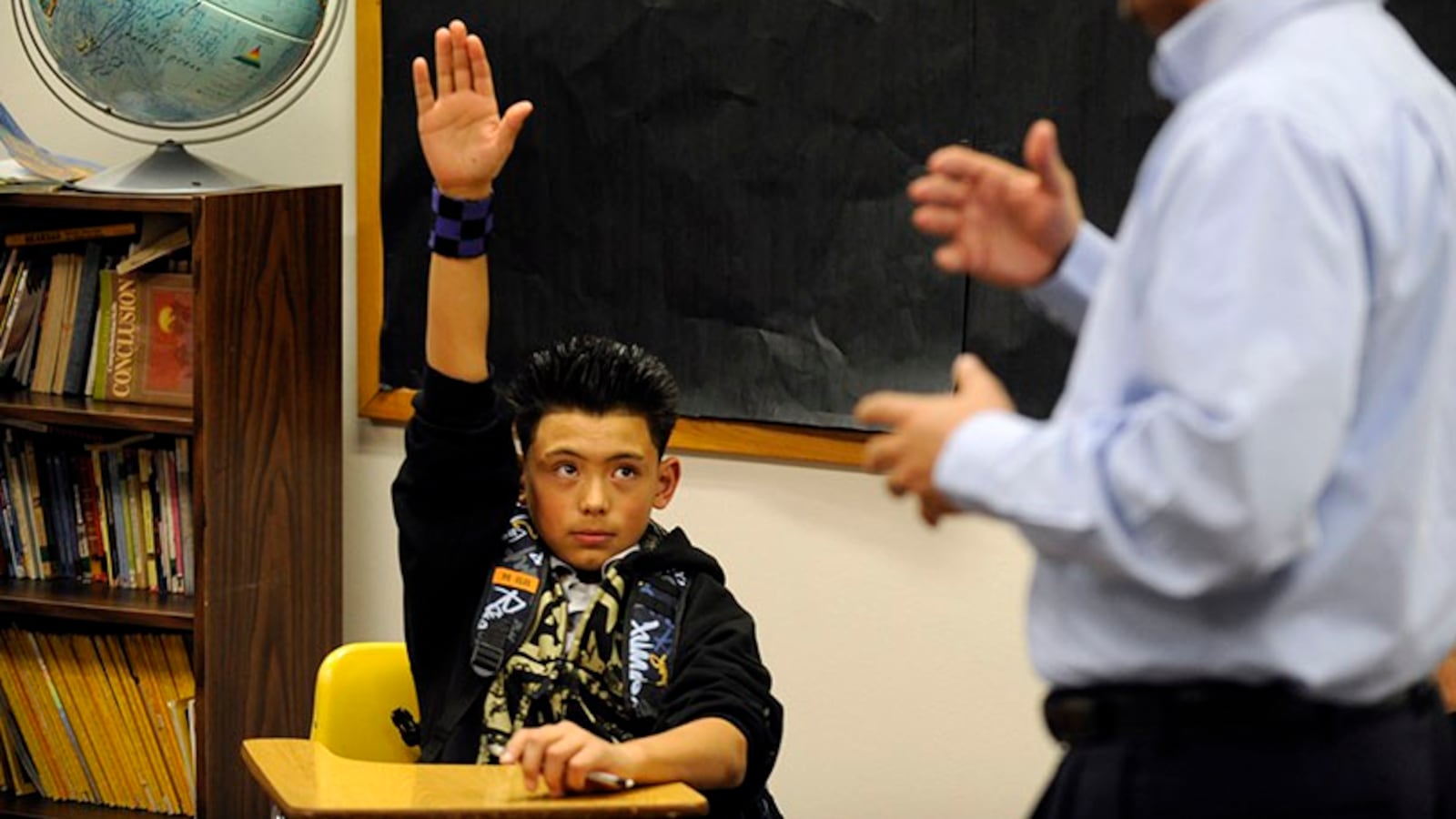 Jorge Robles, 12, raises his hand at Dr. Martin Luther King Jr. Early College in 2010.
