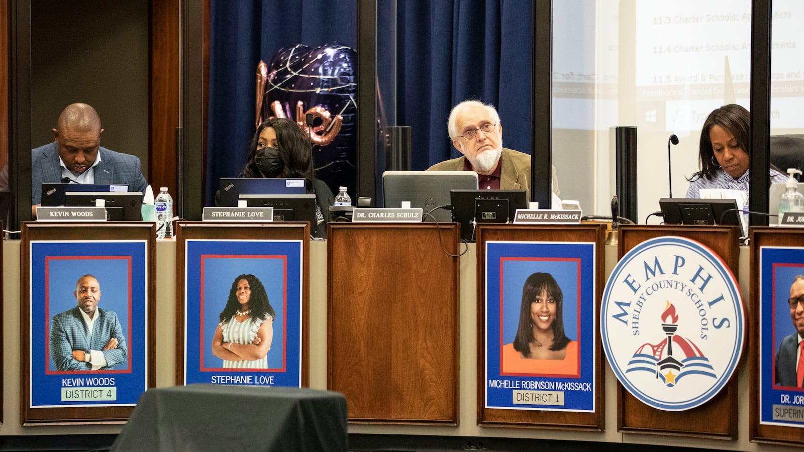 Two women and two men sit behind the dais for the Memphis-Shelby County Schools board