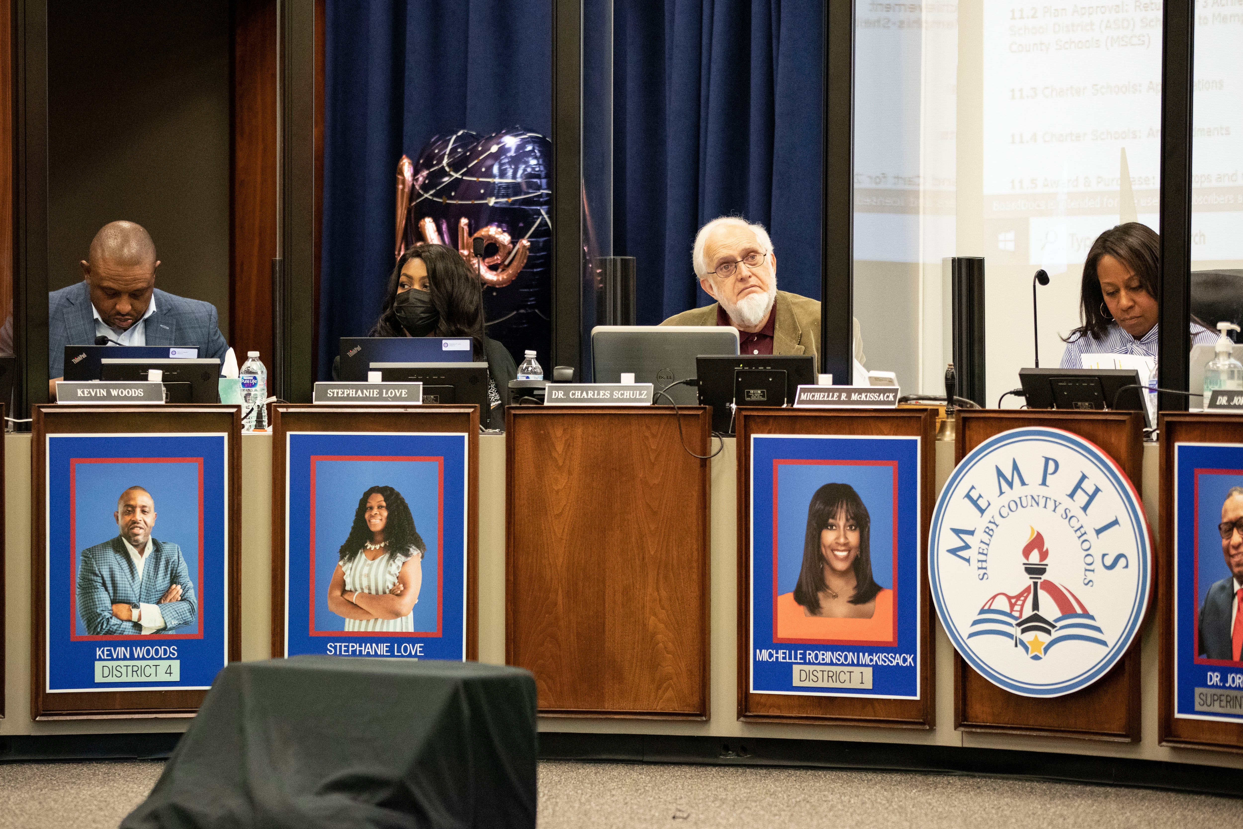 Two women and two men sit behind the dais for the Memphis-Shelby County Schools board