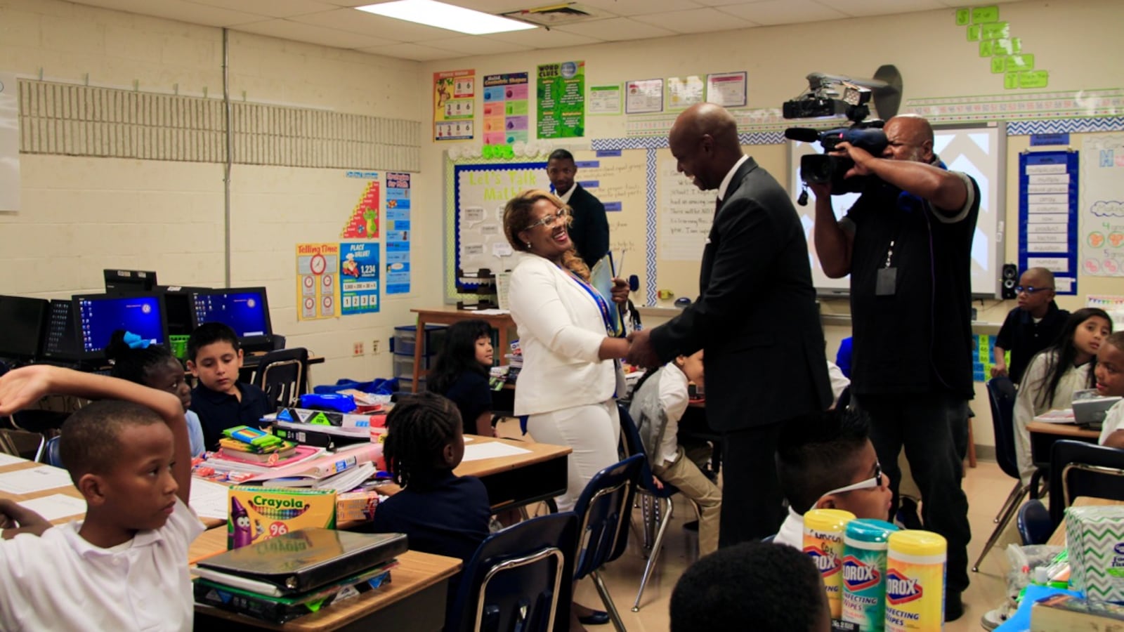 Superintendent Dorsey Hopson greets a third-grade teacher on the first day of school at Bruce Elementary School in Memphis.