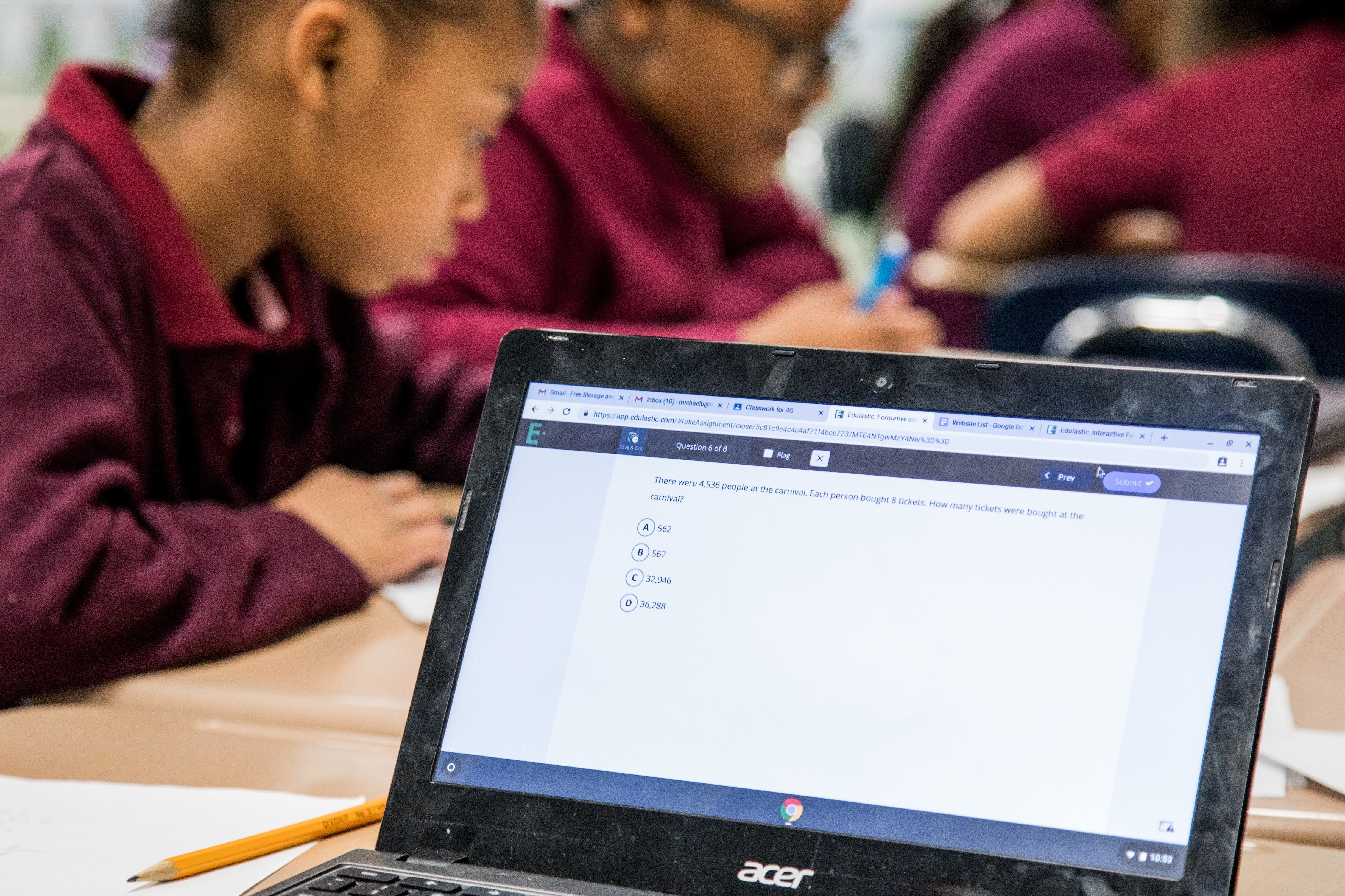 Thea Bowman Leadership Academy students work on a laptop.