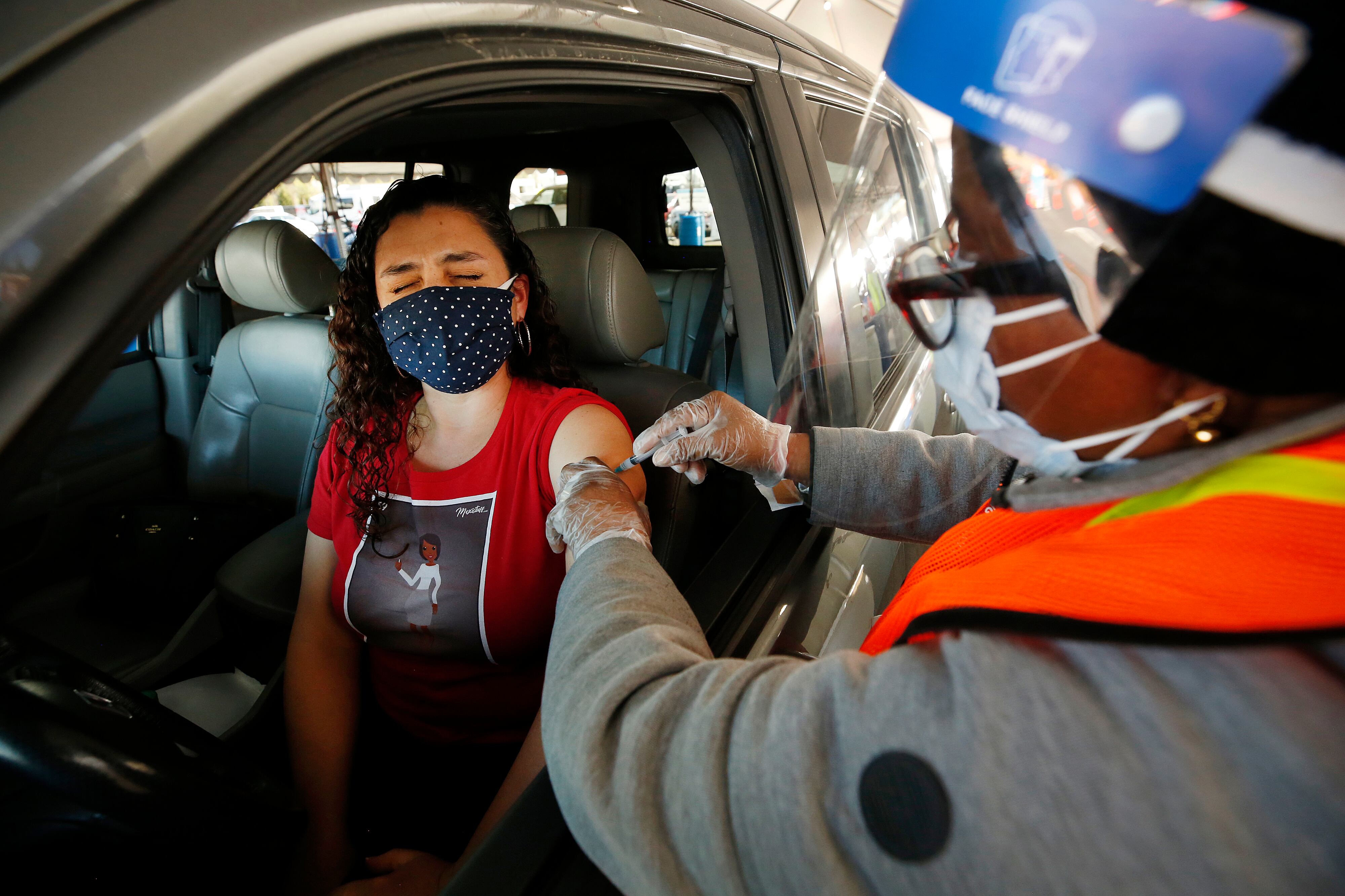 A Los Angeles Unified preschool teacher receives a COVID-19 vaccination shot on March 1, 2021.