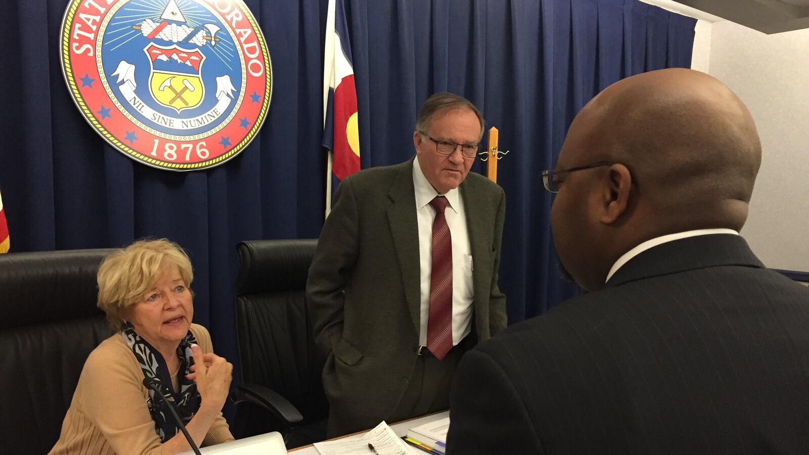 State Board of Education chairman Steve Durham, center, and vice chair Angelika Schroeder meet with Aurora Public Schools Superintendent Rico Munn in May 2015.