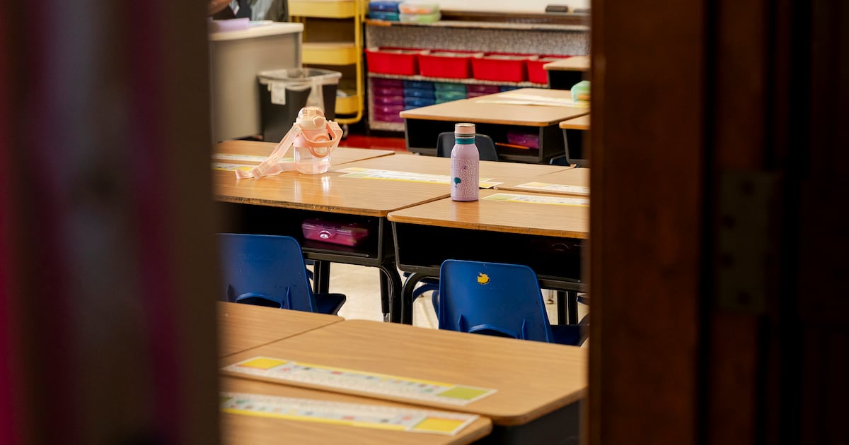 An empty classroom showing a few desks in an elementary school.