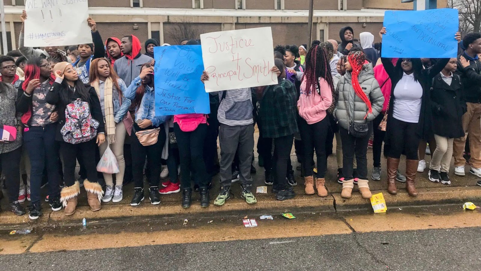 During the protest, students held up signs that read “Justice for Principal Smith” and chanted “We want answers” and “We want Smith.”
