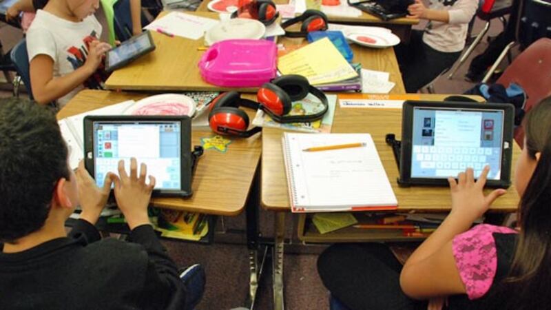 Students at Lumberg Elementary School in Jefferson County work on their assigned iPads during a class project. Photo by Nicholas Garcia