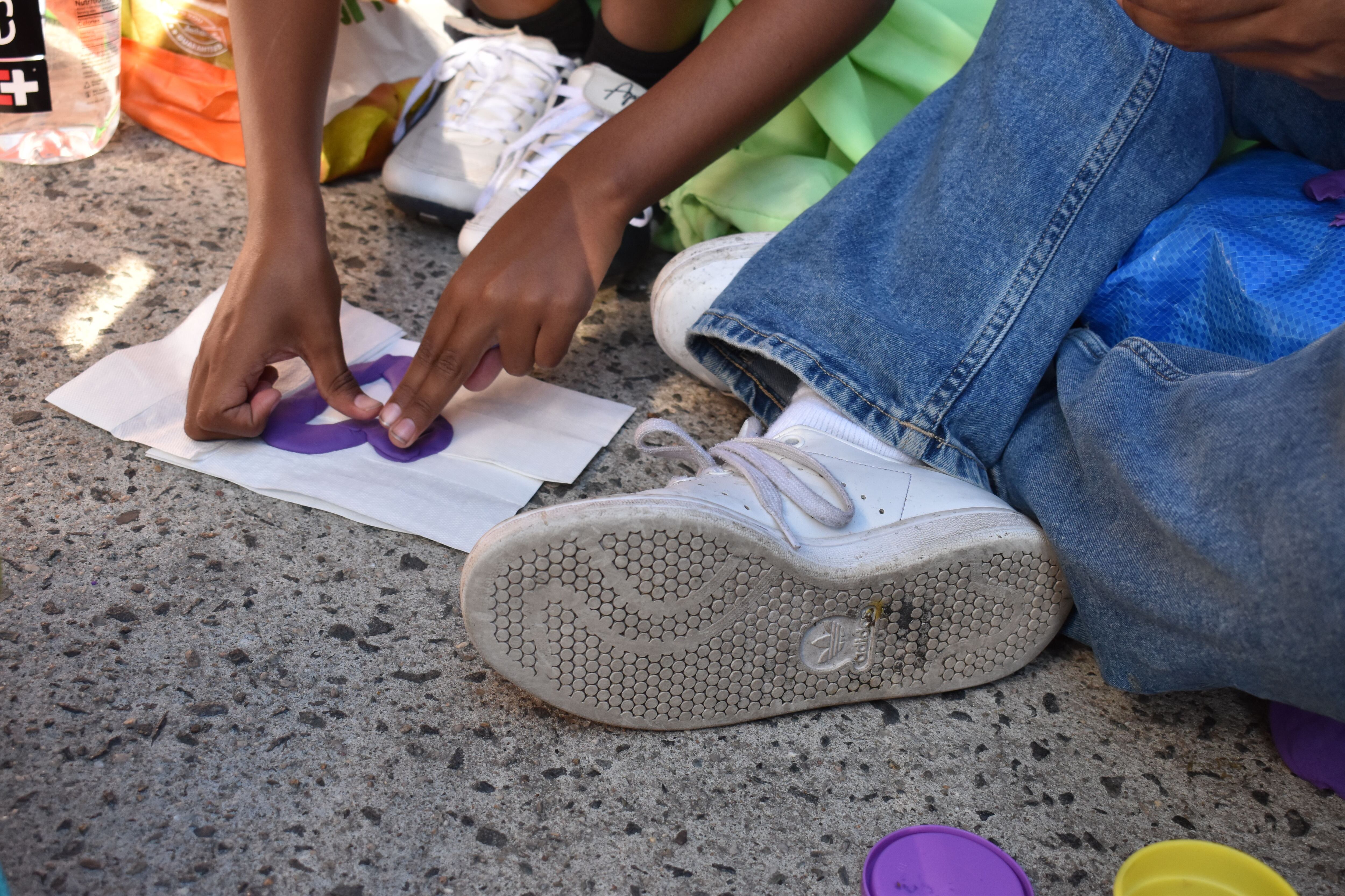 Franyerson, 9, who recently arrived in New York City from Venezuela with his father, plays outside the 30th Street intake center.