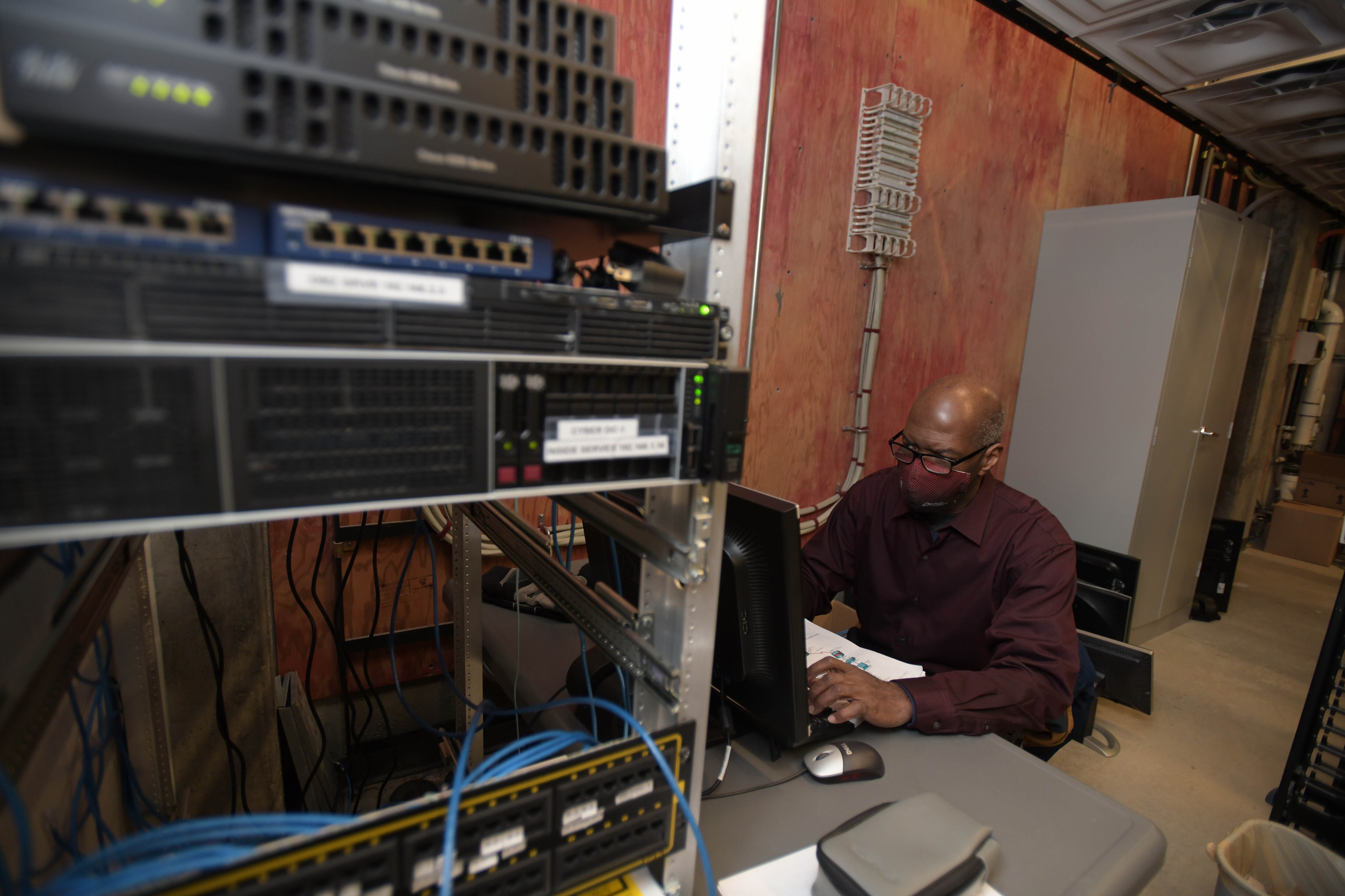 Colorado Northwestern Community College Cybersecurity Program Director Rodney Alexander works in the school’s Craig campus server room.