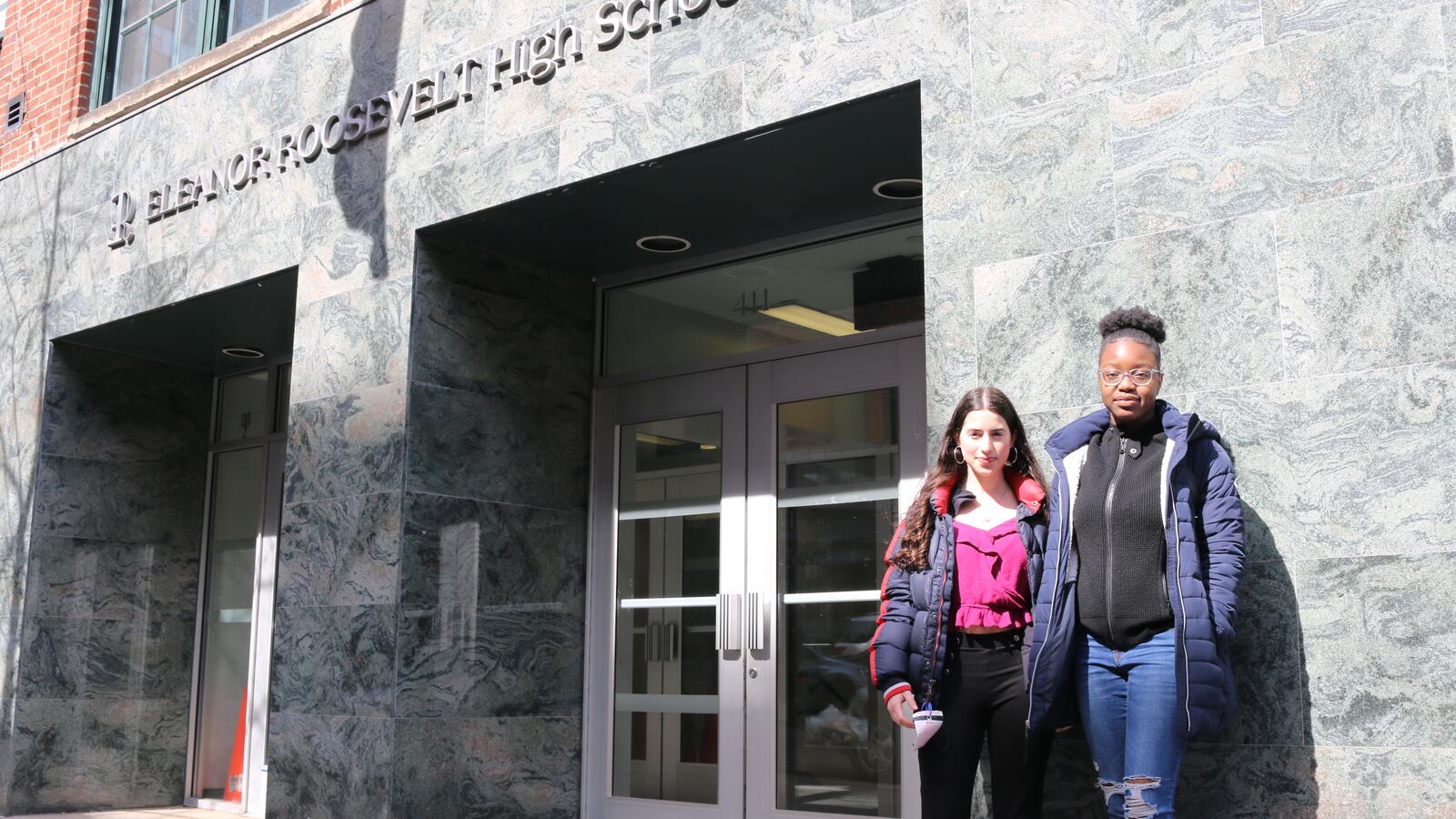Students stand in front of Eleanor Roosevelt High School, which has one of the most rigorous academic screens for admission in the city.
