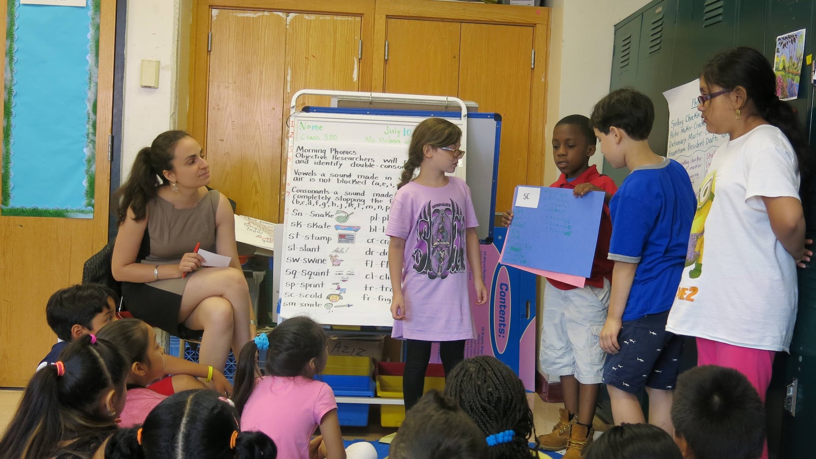 Students at the BELL-P.S./I.S. 218 Summer Quest site present their phonics work to the class.