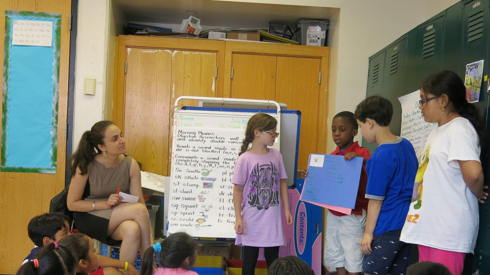 Students at the BELL-P.S./I.S. 218 Summer Quest site present their phonics work to the class.