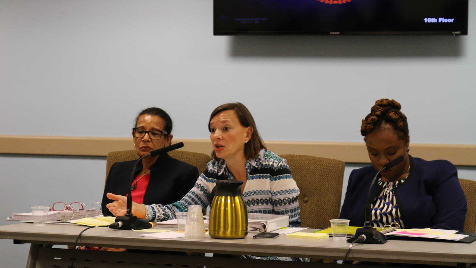 Deputy Chancellor Elizabeth Rose (center) answers questions from lawmakers at a hearing on Wednesday.
