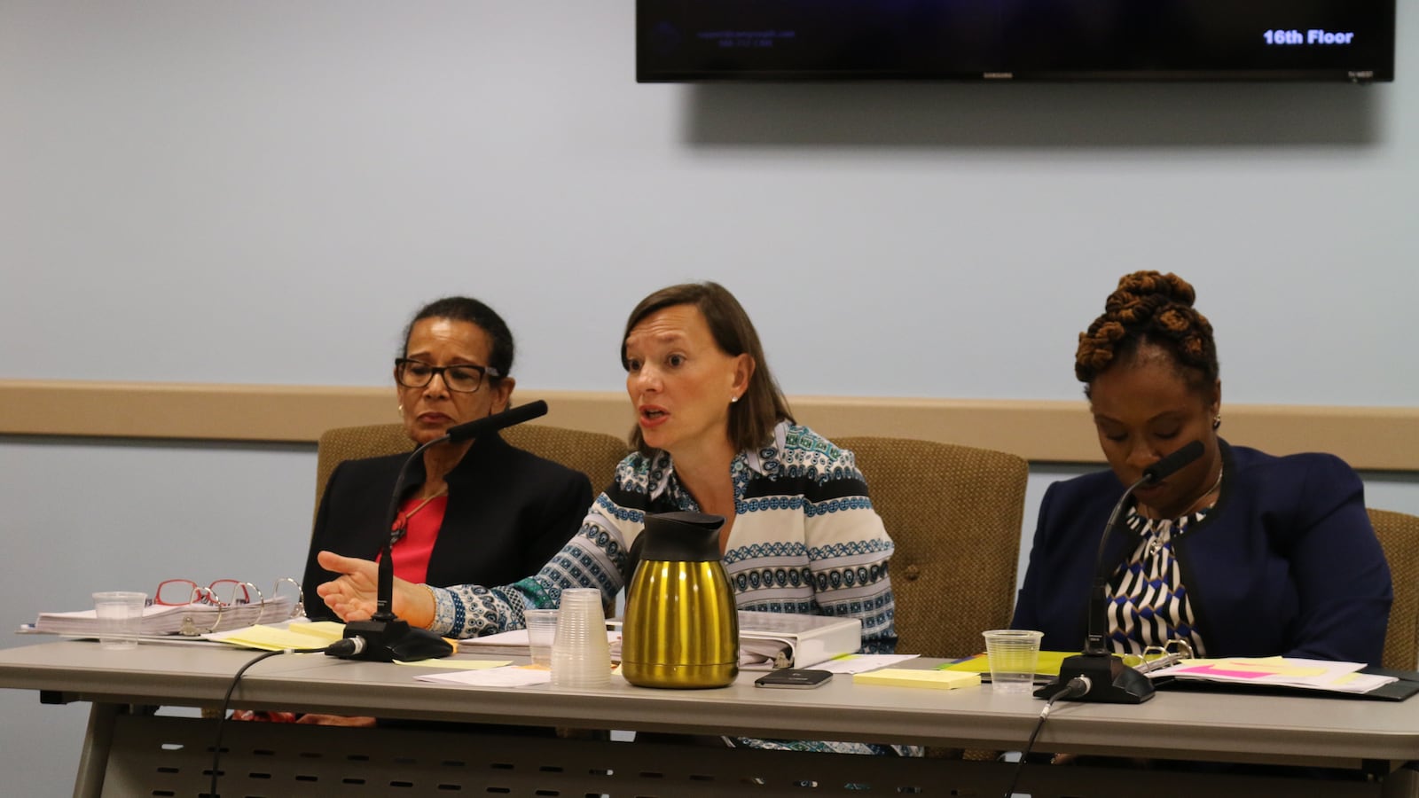 Deputy Chancellor Elizabeth Rose (center) answers questions from lawmakers at a hearing on Wednesday.