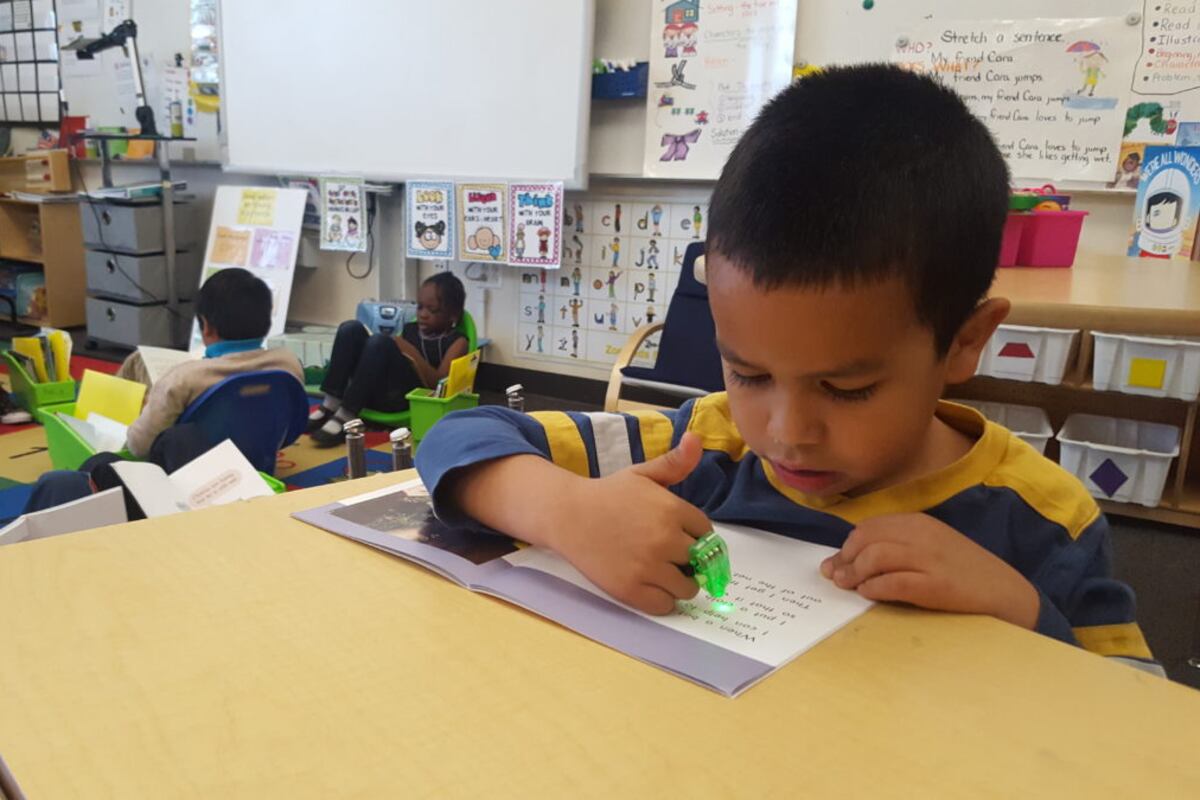 File photo of first graders reading at Paris Elementary, an innovation school in Aurora.