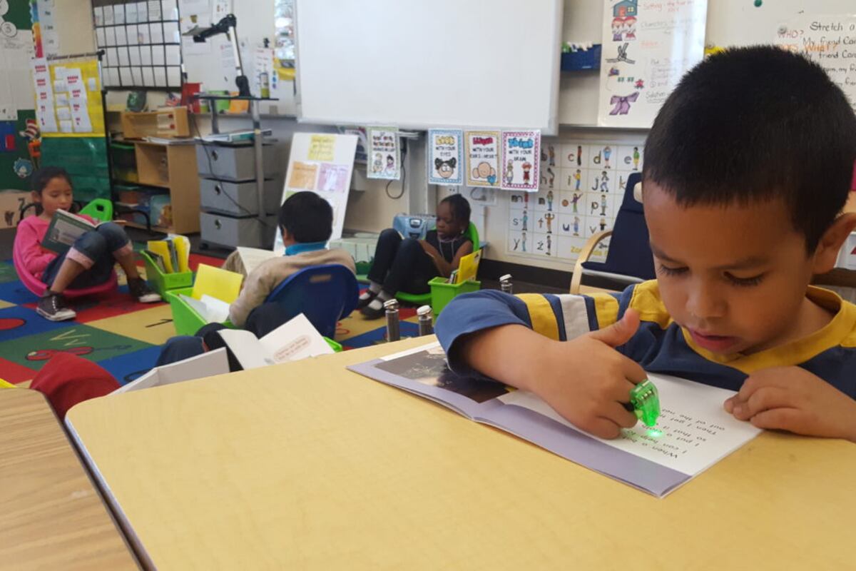 File photo of first graders reading at Paris Elementary, an innovation school in Aurora.