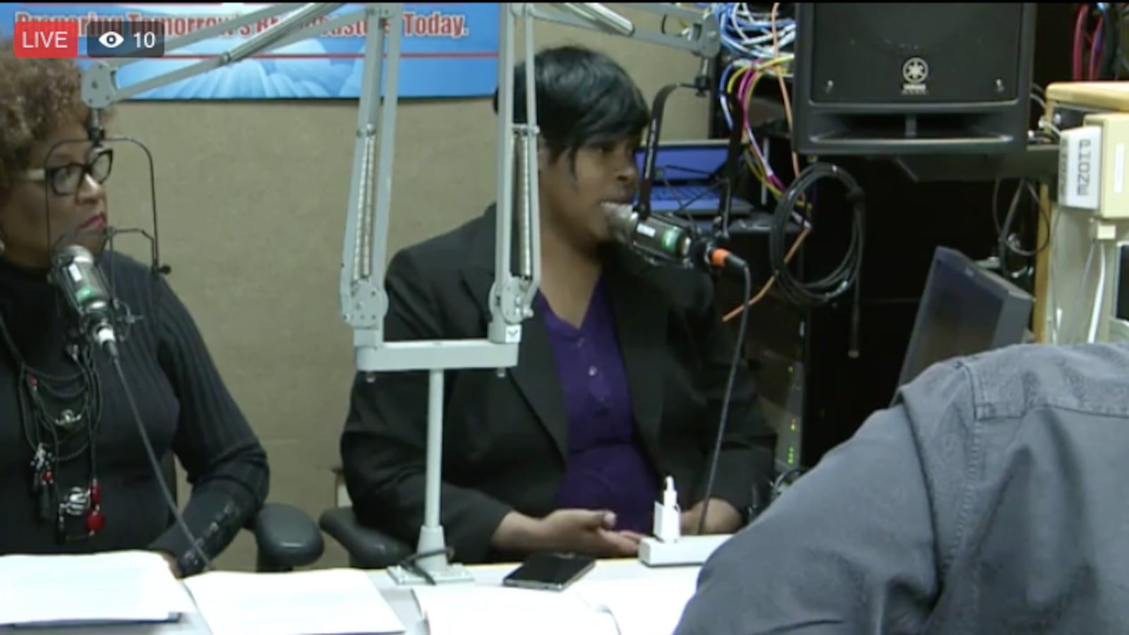 Stephanie Love, a member of the Shelby County Board of Education, rallies against a school voucher bill during a Memphis radio broadcast on Sunday.