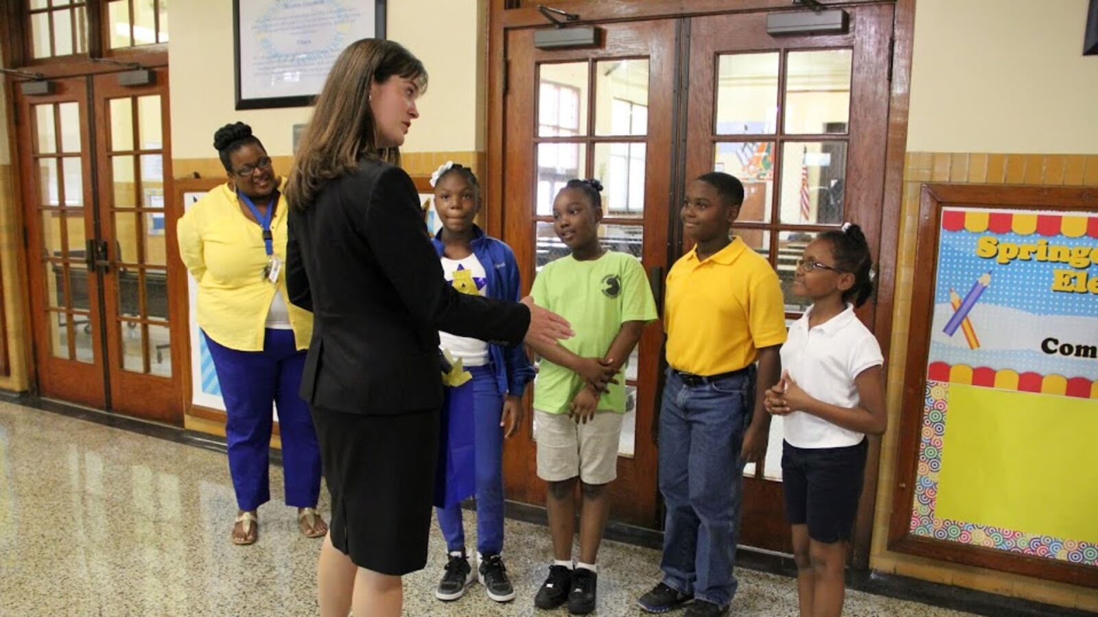 Tennessee Education Commissioner Candice McQueen is greeted by students and staff at Springdale Memphis Magnet Elementary School during a 2015 svisit.