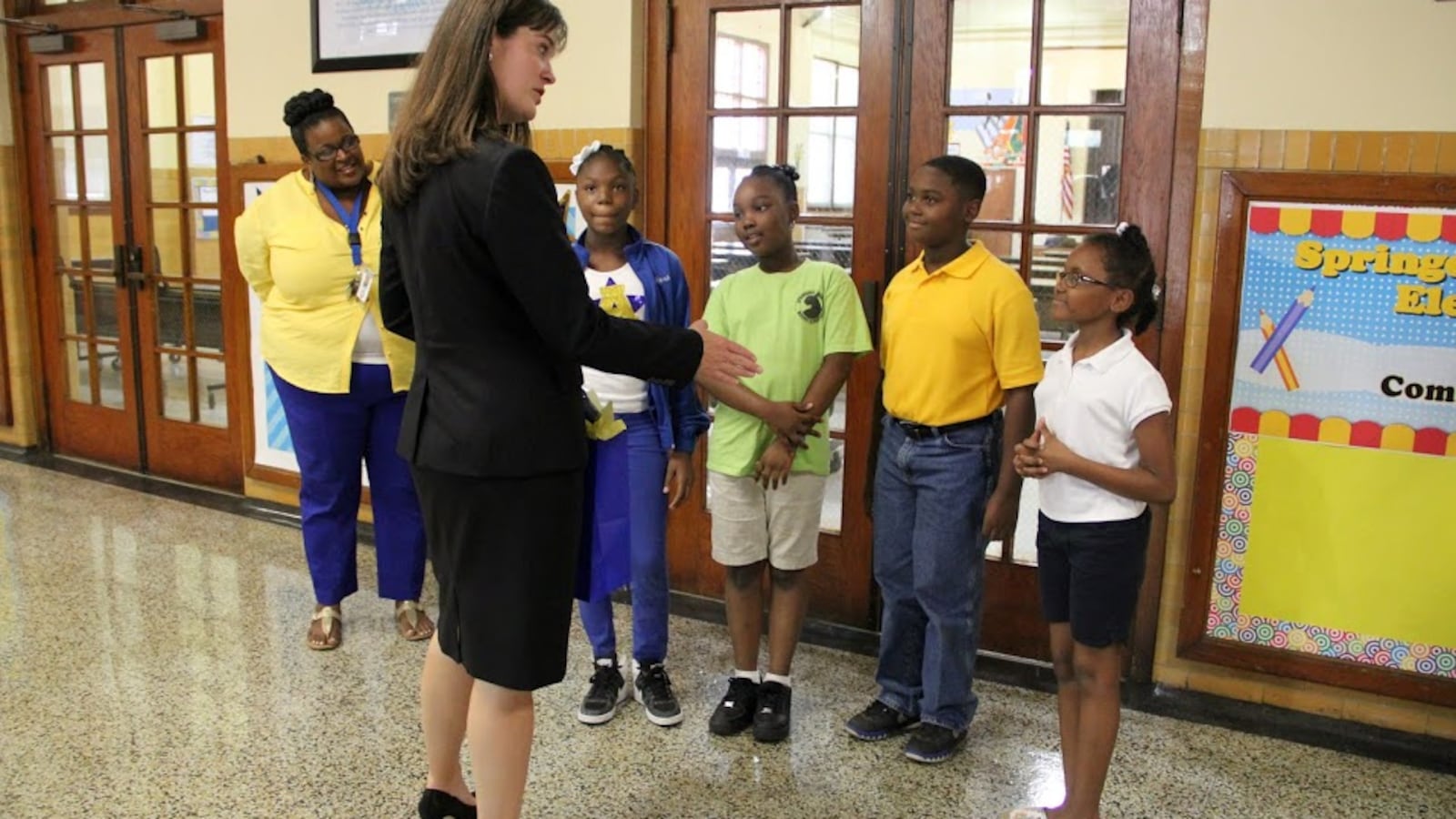 Tennessee Education Commissioner Candice McQueen is greeted by students and staff at Springdale Memphis Magnet Elementary School during a 2015 svisit.