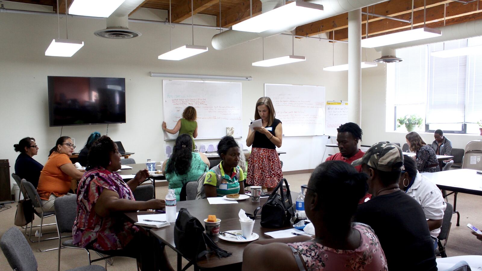 Parent members of Community Organizing and Family Issues in Chicago discuss on July 31, 2018, how to advocate for their special-needs children.