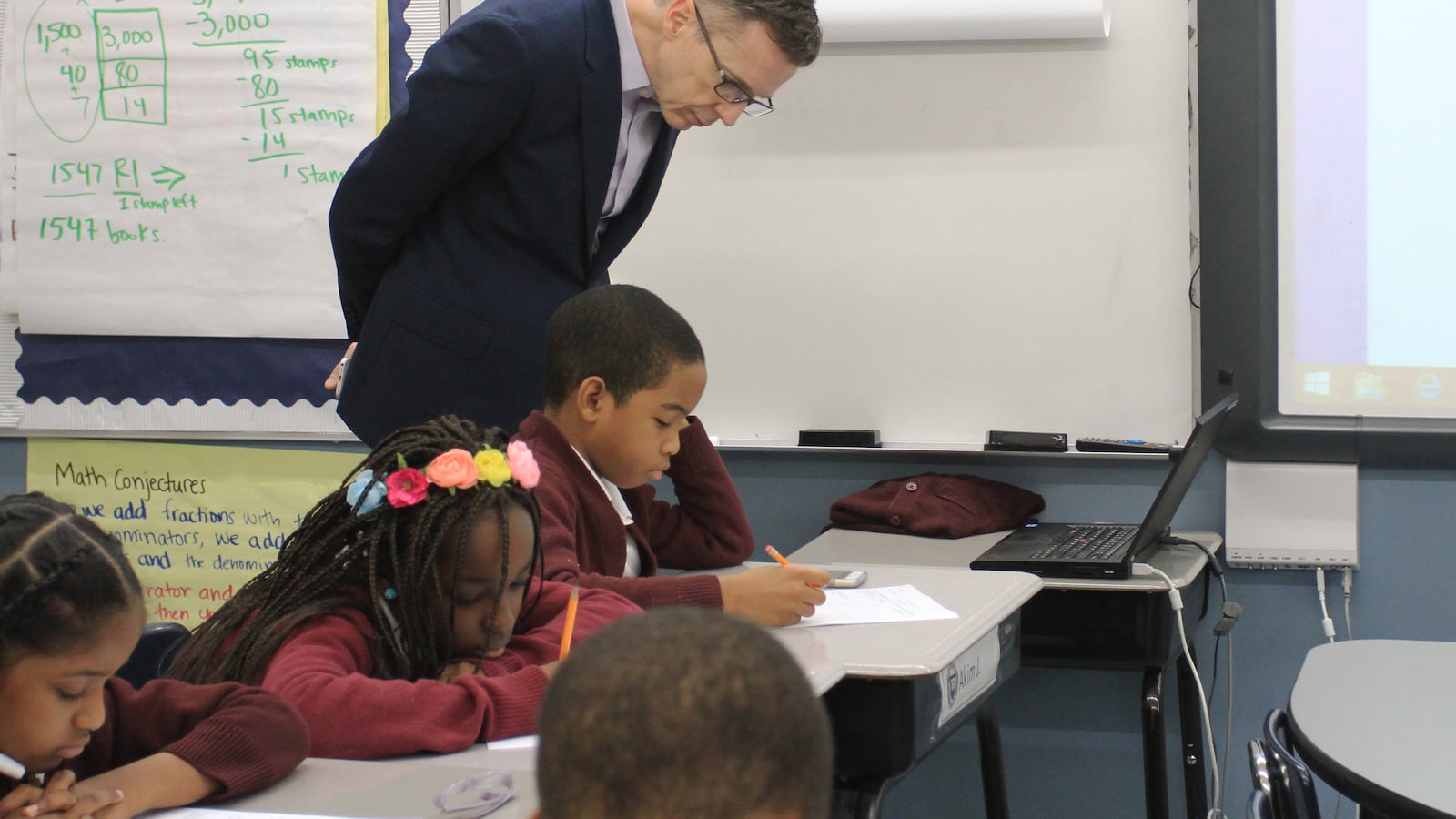 Ascend charter school network CEO Steve Wilson observes students in a fourth-grade English class in 2016.