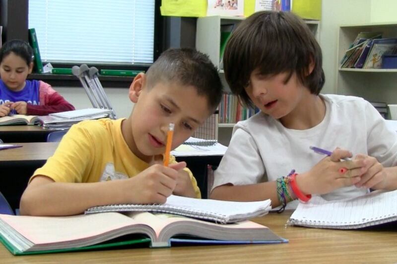 Students at Sheridan’s Fort Logan Elementary collaborate on a literacy lesson.