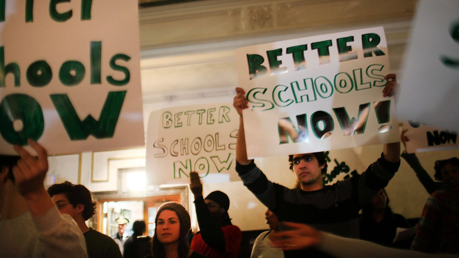 People protest during a Panel for Educational Policy meeting at Brooklyn Tech High School before they vote on whether to close or partially close 23 schools that the Department of Education considers failing on February 9, 2012 in New York City. (Photo by Spencer Platt/Getty Images)