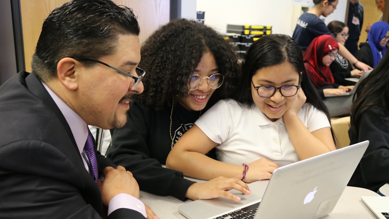Seventh-grade students at Young Women’s Leadership School in Queens teach Chancellor Richard Carranza how to code using the Scratch programming language.