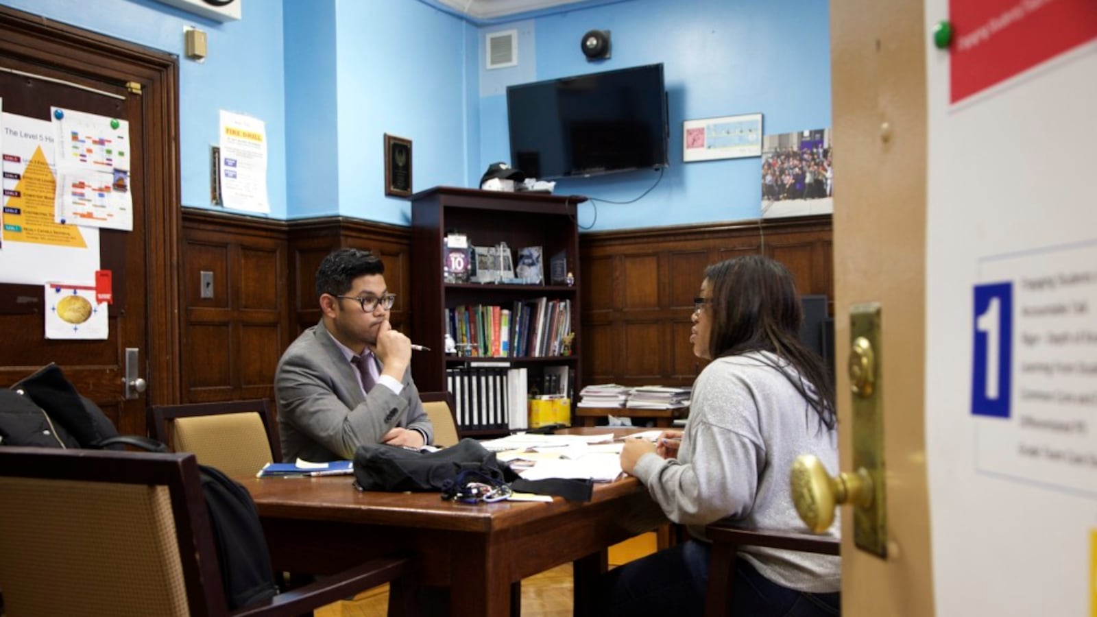 Principal Carl Manalo's small high school in Queens enrolled more than 100 new Central American immigrants.