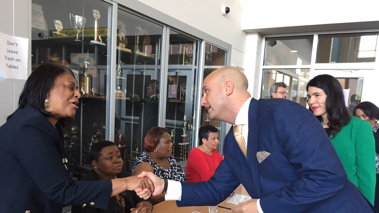On his first day as Detroit schools superintendent, Nikolai Vitti, with former interim superintendent Alycia Meriweather, greets principals at a teacher hiring fair at Martin Luther King Jr. High School.