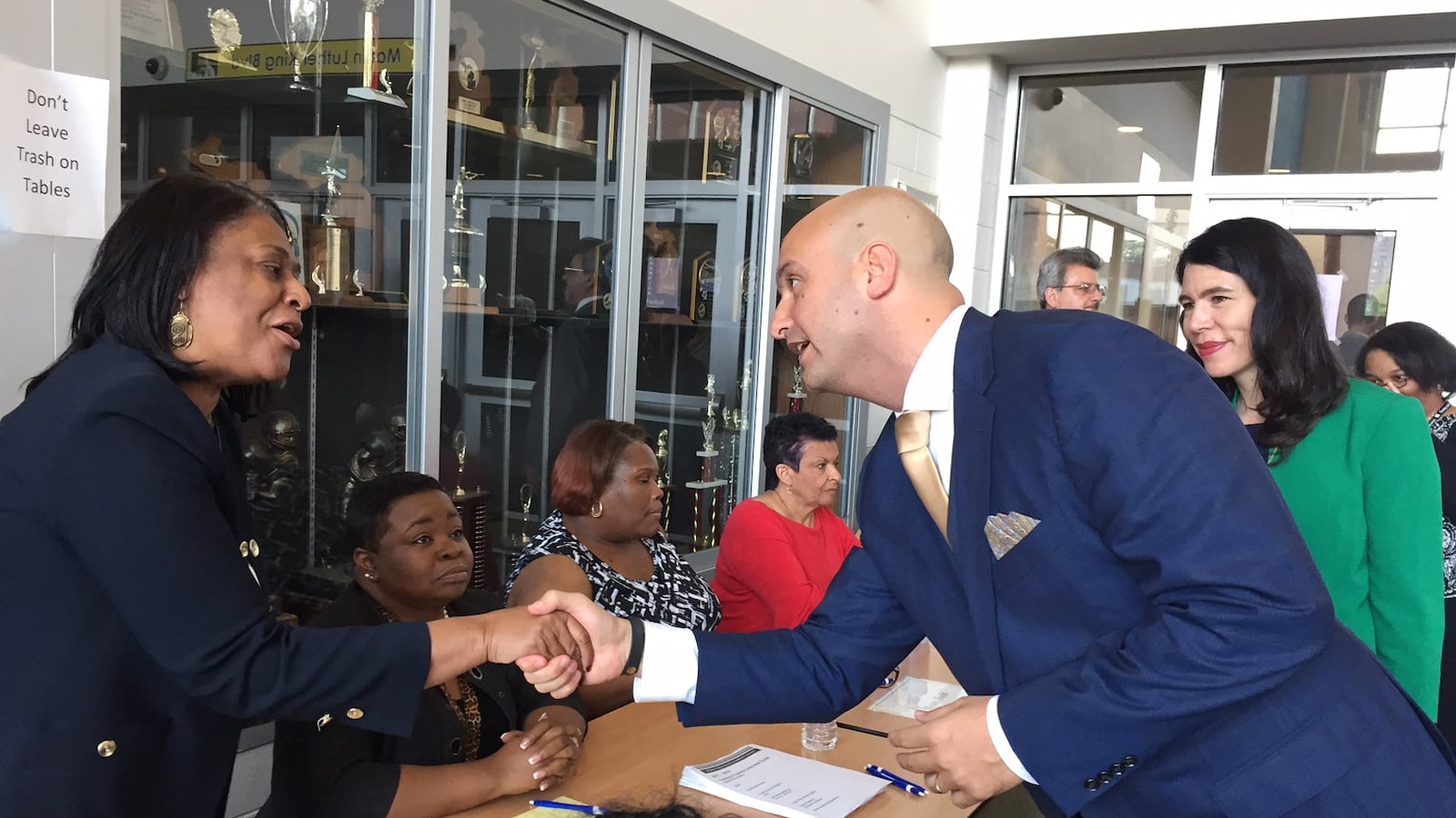 On his first day as Detroit schools superintendent, Nikolai Vitti, with former interim superintendent Alycia Meriweather, greets principals at a teacher hiring fair at Martin Luther King Jr. High School.