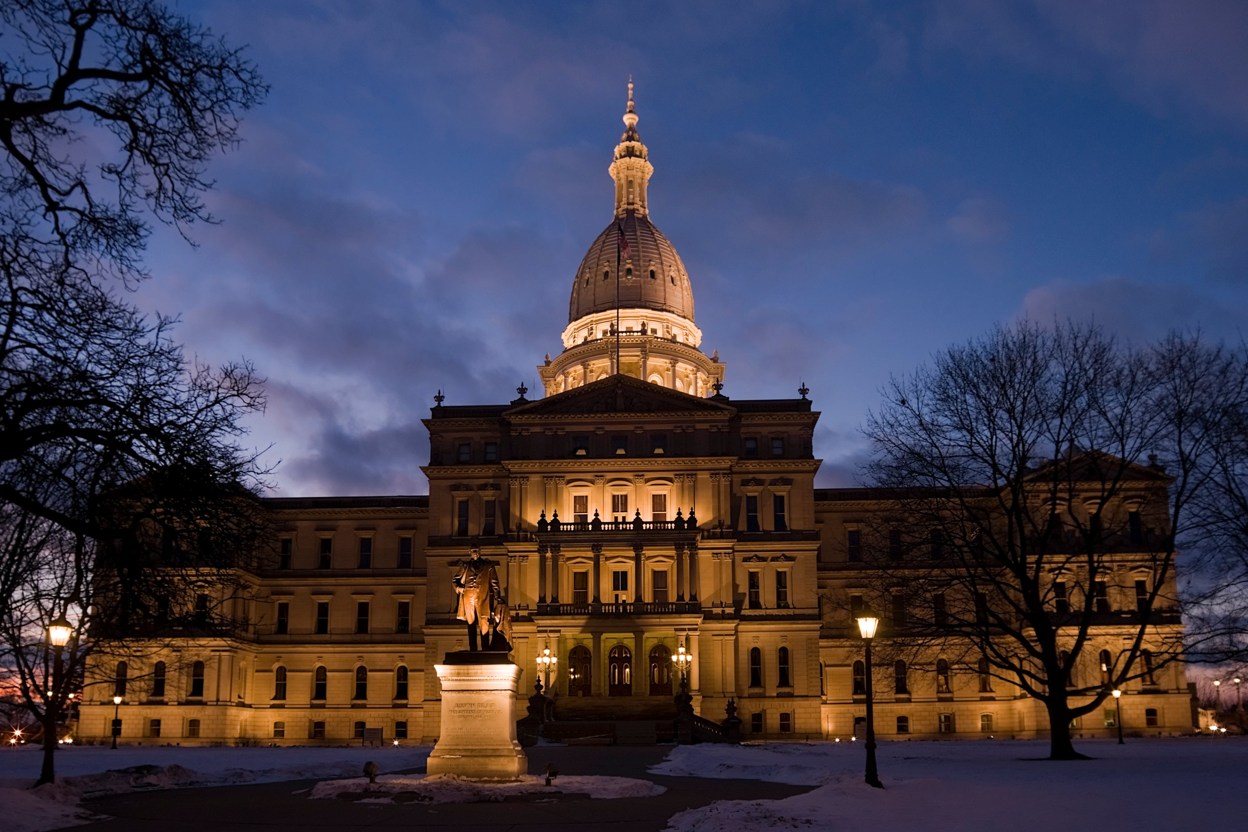 A large building illuminated in the dark.