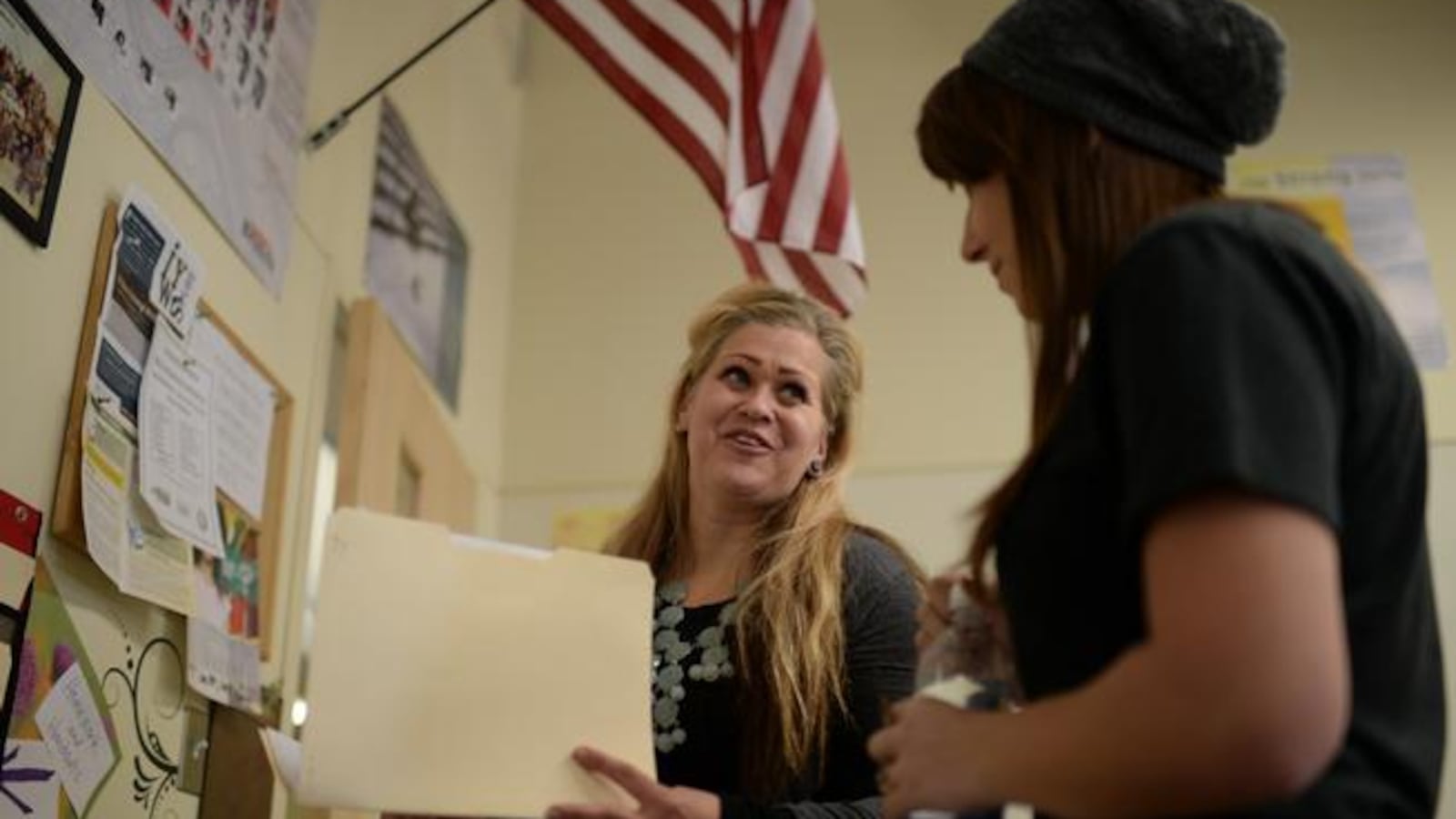 High school language arts teacher Kimba Rael, left, talks homework with student Shantelle Bell, Centennial High School in San Luis (Photo by Hyoung Chang/The Denver Post).