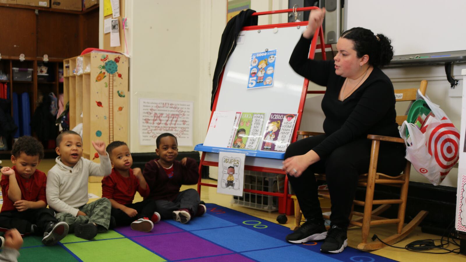 Kristal Torres leads 3-K students in a song at P.S. 277 in the Bronx. Mayor Bill de Blasio has pushed to make pre-K universally available to students starting at 3-years-old.