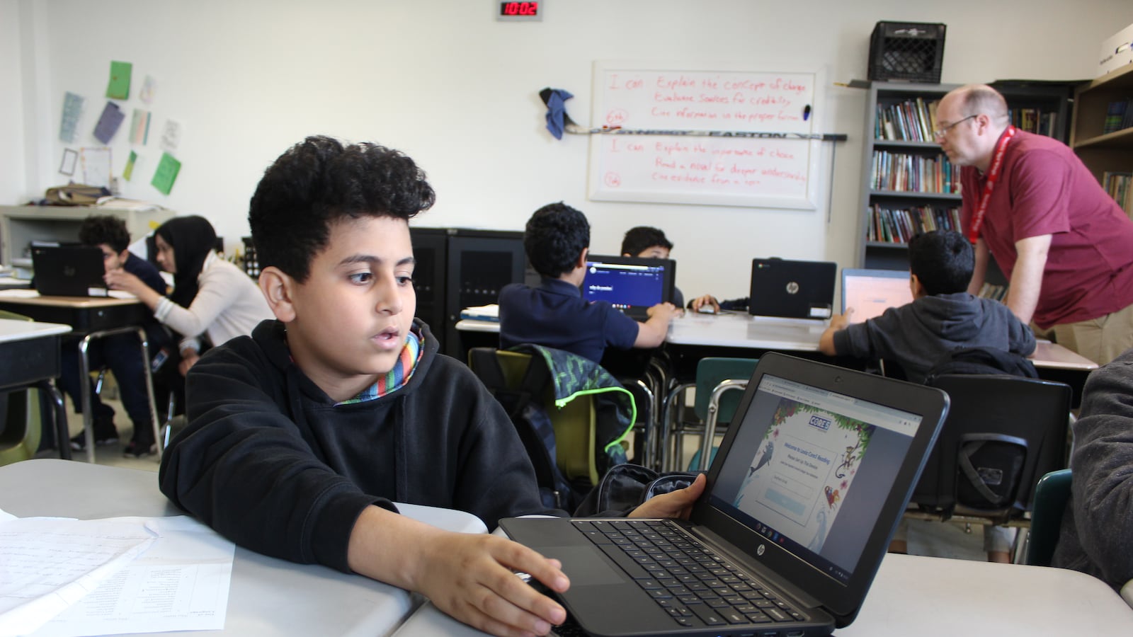 A student at Bridge Academy West in Detroit shows off a computer program designed for students who speak English as a second language.