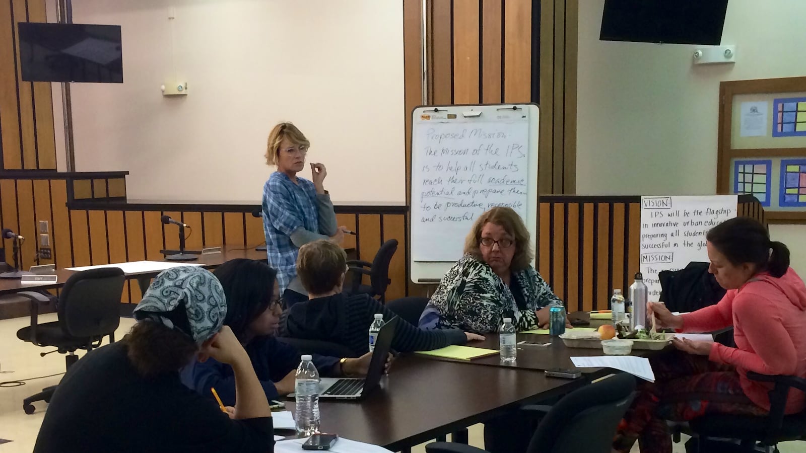 IPS board members talk at a public work session.