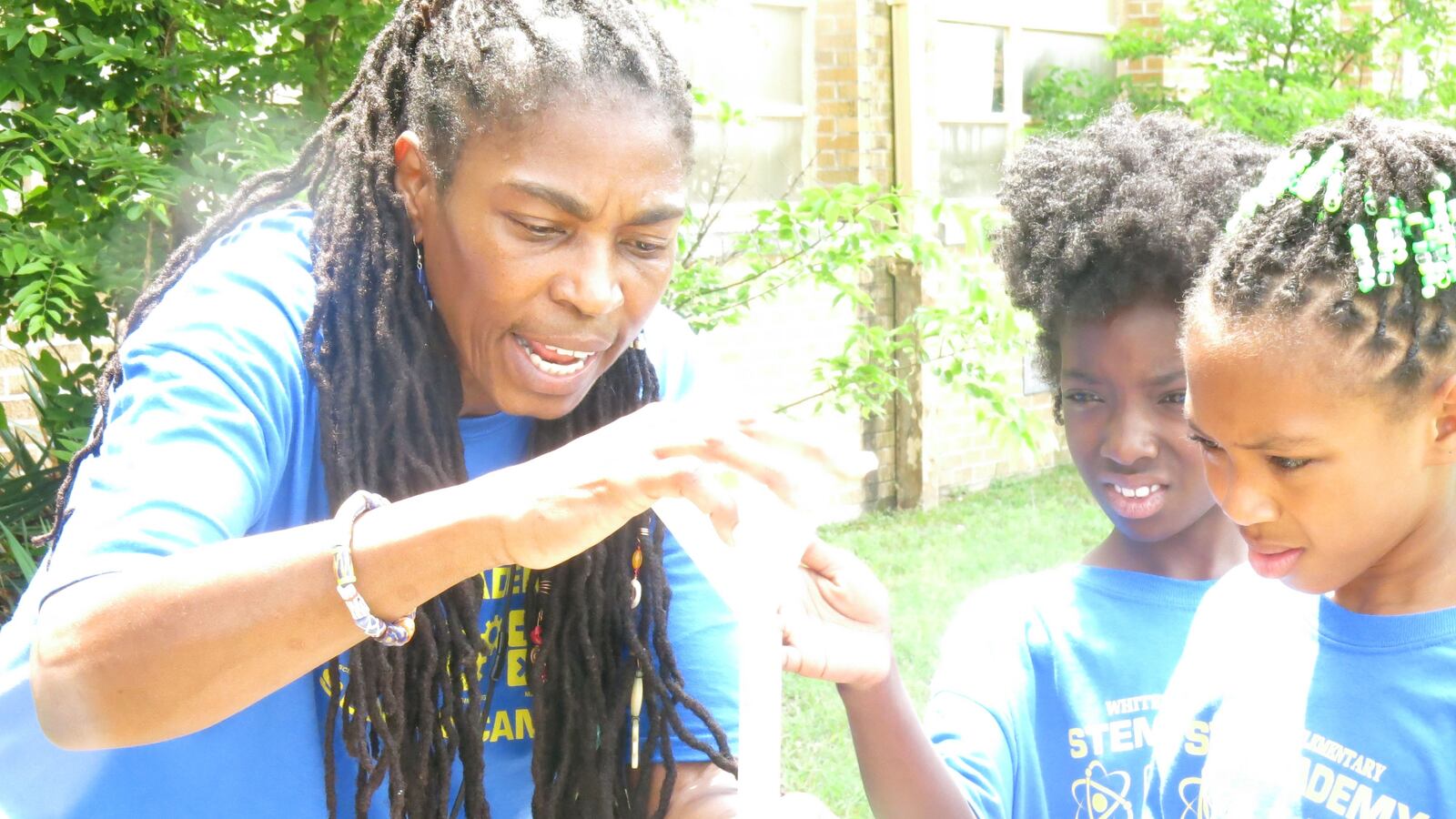 Deborah Kofie a teacher at Whitehaven Elementary, helps her students prepare the rockets for lift-off. Whitehaven is a STEM school.
