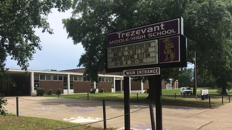 An exterior of a school building, identified on a sign as Trezevant High School.