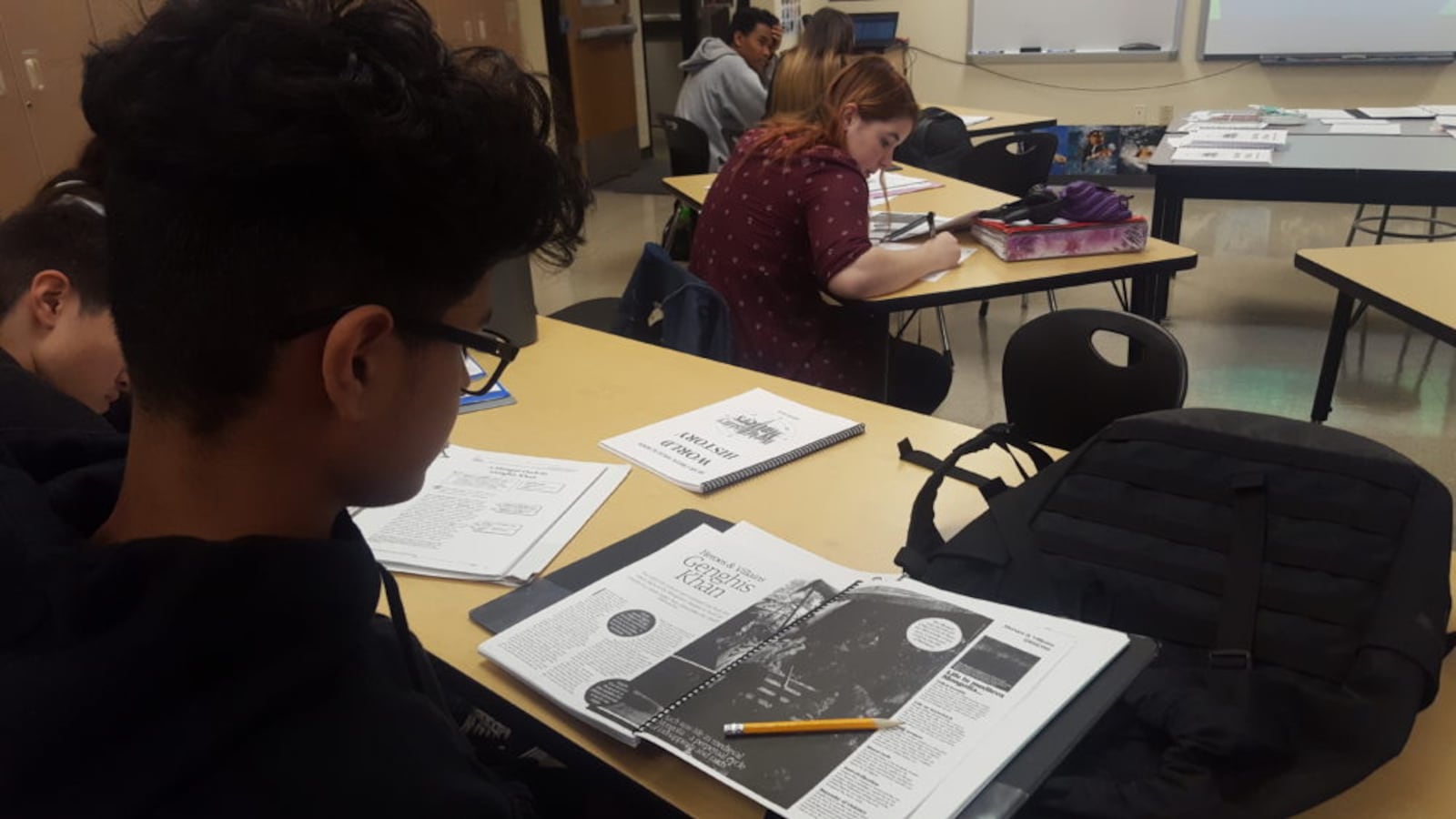 Students in a social studies class at Bear Creek High School in Jeffco Public Schools read about Genghis Khan.
