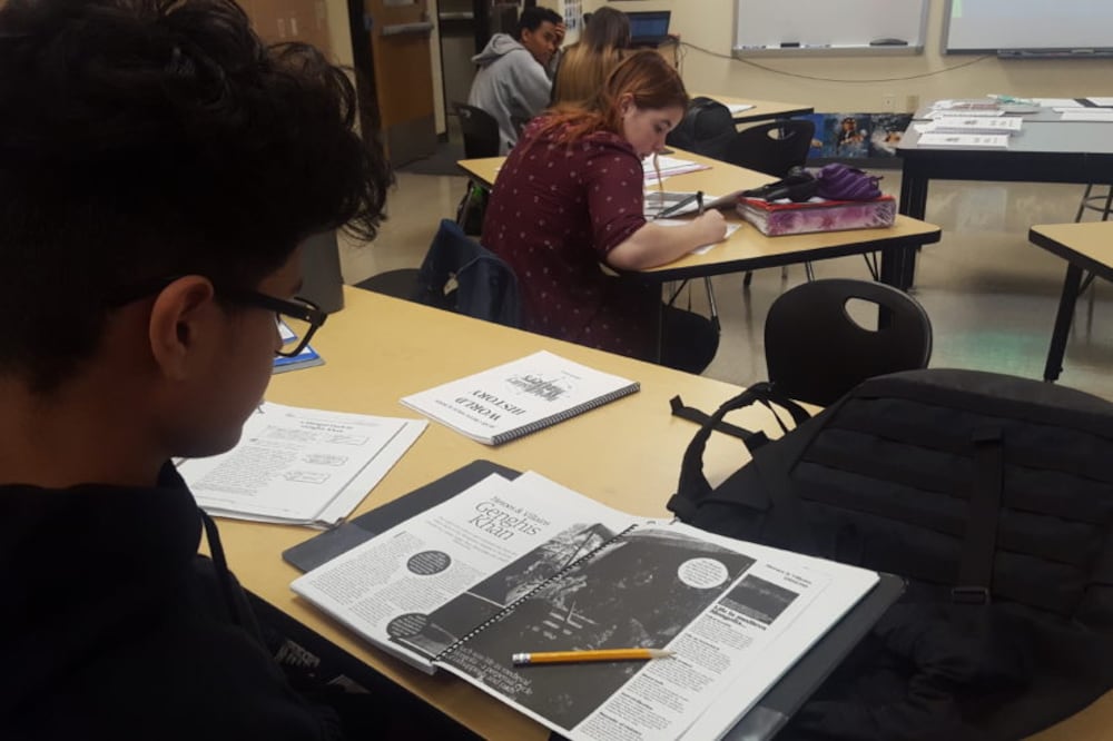 Students in a social studies class at Bear Creek High School in Jeffco Public Schools read about Genghis Khan.