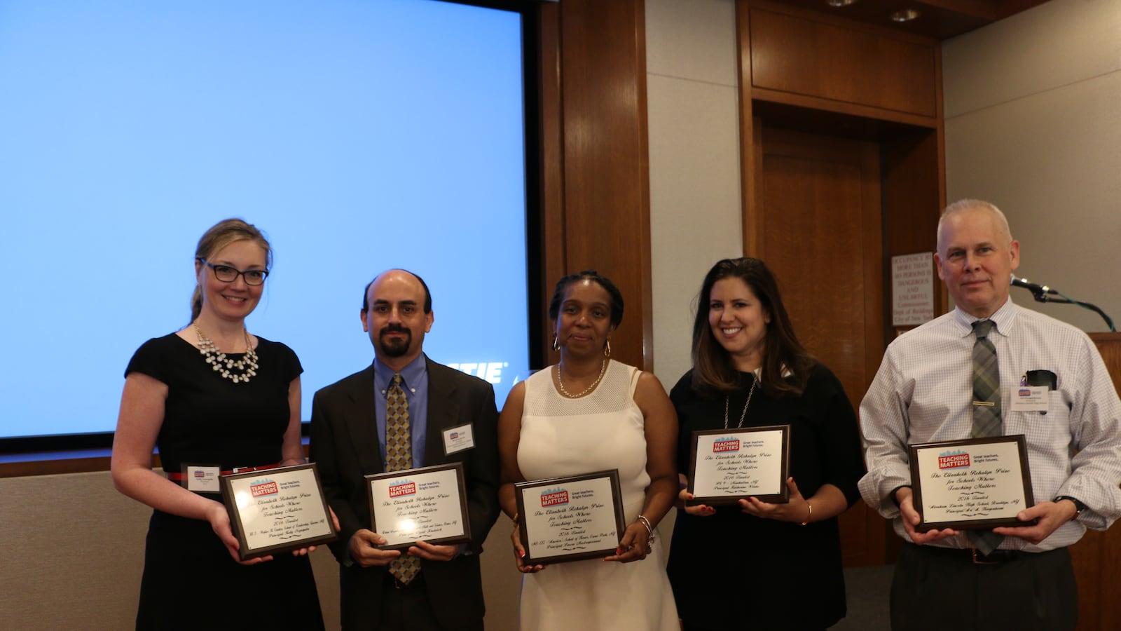 Joanna Freedman (second from right), pictured here with four other semi-finalists, accepted the grand prize Teaching Matters award
