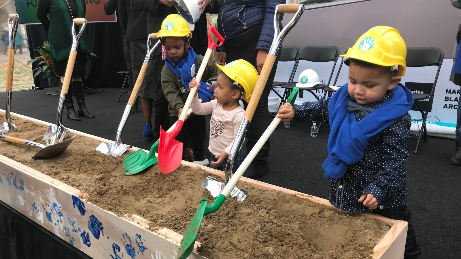 Preschool children do their part during a ceremonial groundbreaking event for a new early childhood education center at Marygrove College.