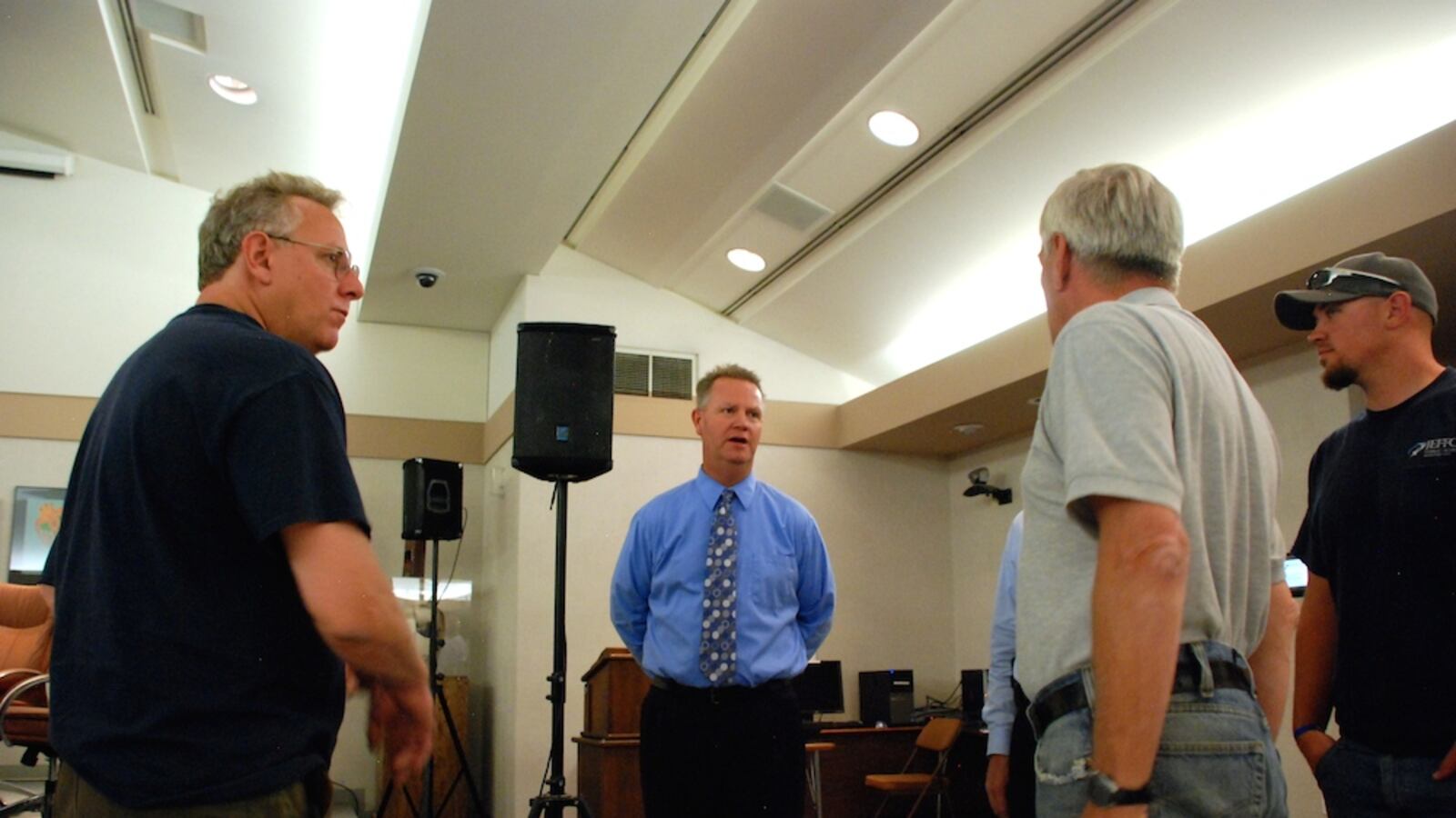 Jeffco Public Schools Superintendent Dan McMinimee, center, meets with district staff July 1, his first day on the job at the district's headquarters in Golden.