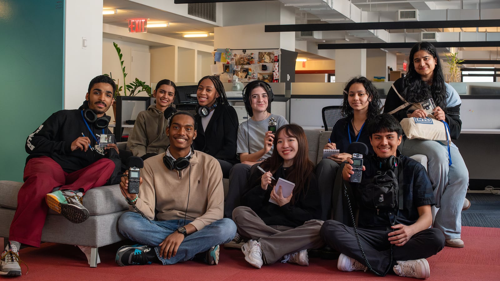 A group of high school teenagers pose for a portrait.