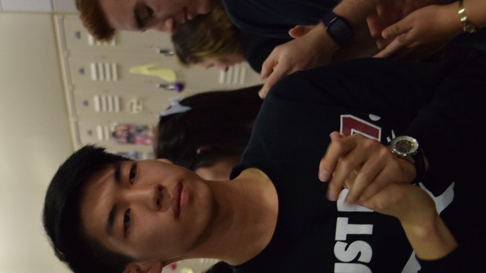 Alex Chen walks the hallway during a student sit-in he helped organize at Townsend Harris High School.