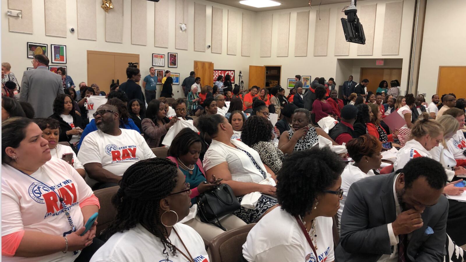 Supporters of interim superintendent Joris Ray wore “Stay with Ray” T-shirts including the district’s logo Tuesday.