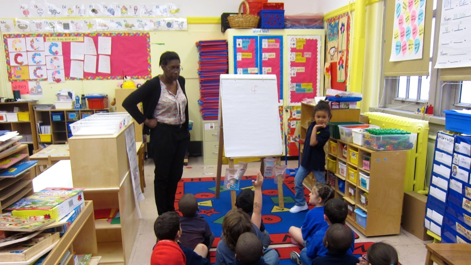 Judith Colon, left, asks her pre-K students at P.S. 63 to use the word "if" in a sentence.