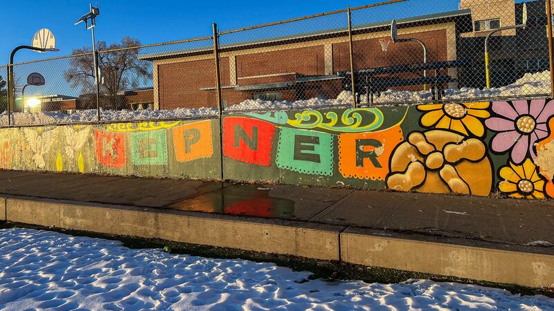 A colorful mural spelling “KEPNER” on a wall of a middle school campus